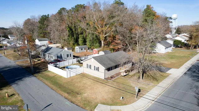a view of a swimming pool with sitting area