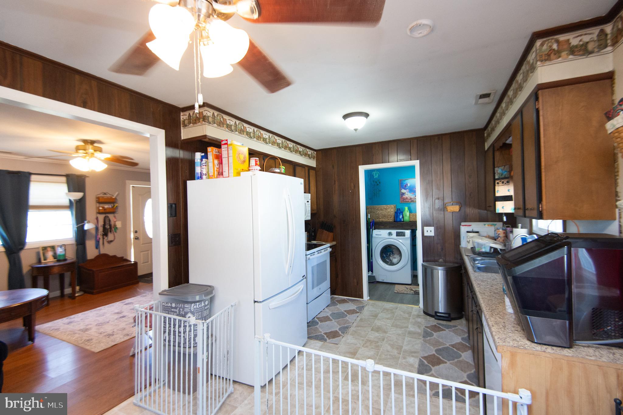 133 South Street Secretary, MD 21664 - Photo 10 of 39 a view of a livingroom with furniture and a flat screen tv