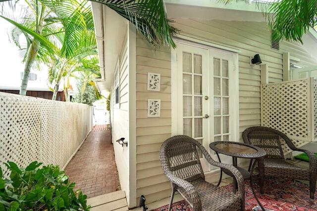 1218 Packer Street, Unit REAR Key West, FL 33040 - Photo 20 of 22 a balcony view with a seating space
