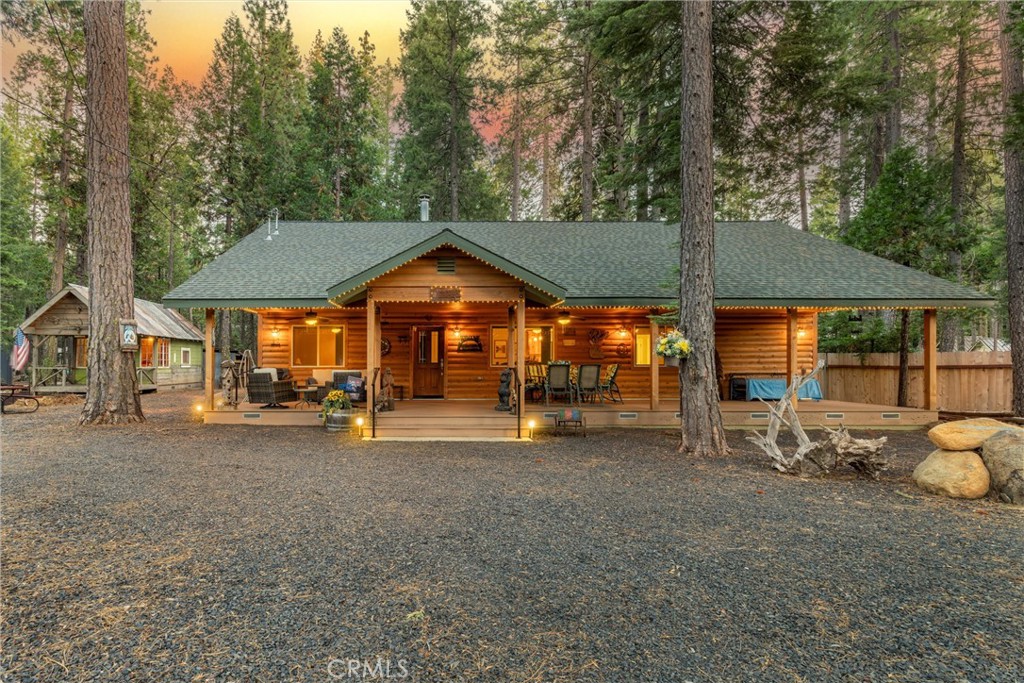 a view of a outdoor space with a patio and wooden fence
