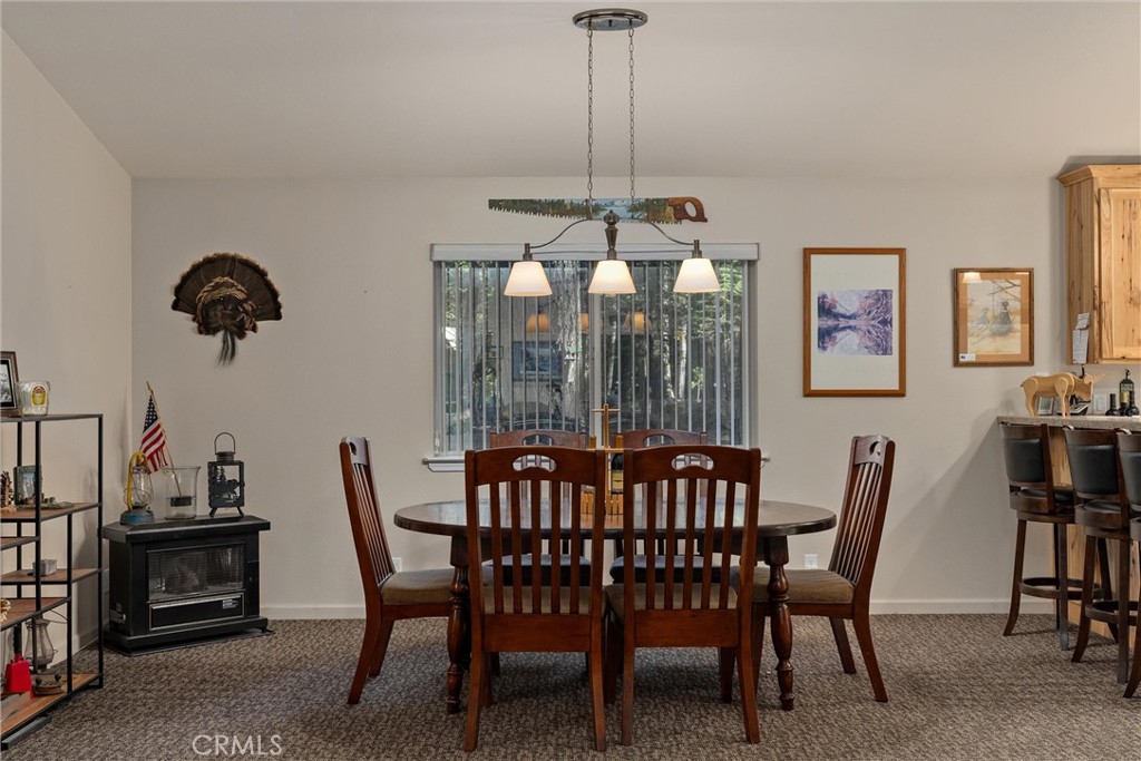 7528 Humboldt Road Butte Meadows, CA 95942 - Photo 11 of 41 a view of a dining room with furniture window and outside view