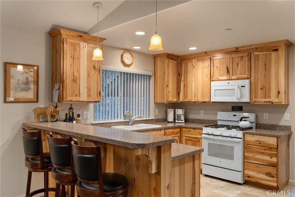 7528 Humboldt Road Butte Meadows, CA 95942 - Photo 13 of 41 a kitchen that has a sink and a stove in it