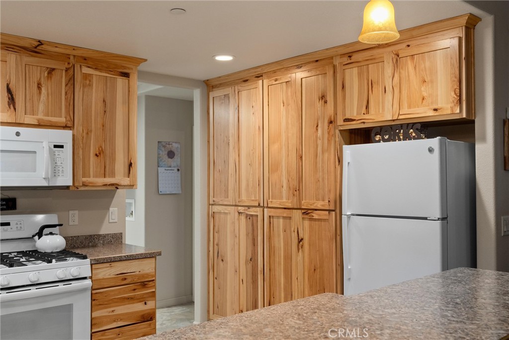 7528 Humboldt Road Butte Meadows, CA 95942 - Photo 14 of 41 a kitchen with stainless steel appliances granite countertop a refrigerator and a stove top oven