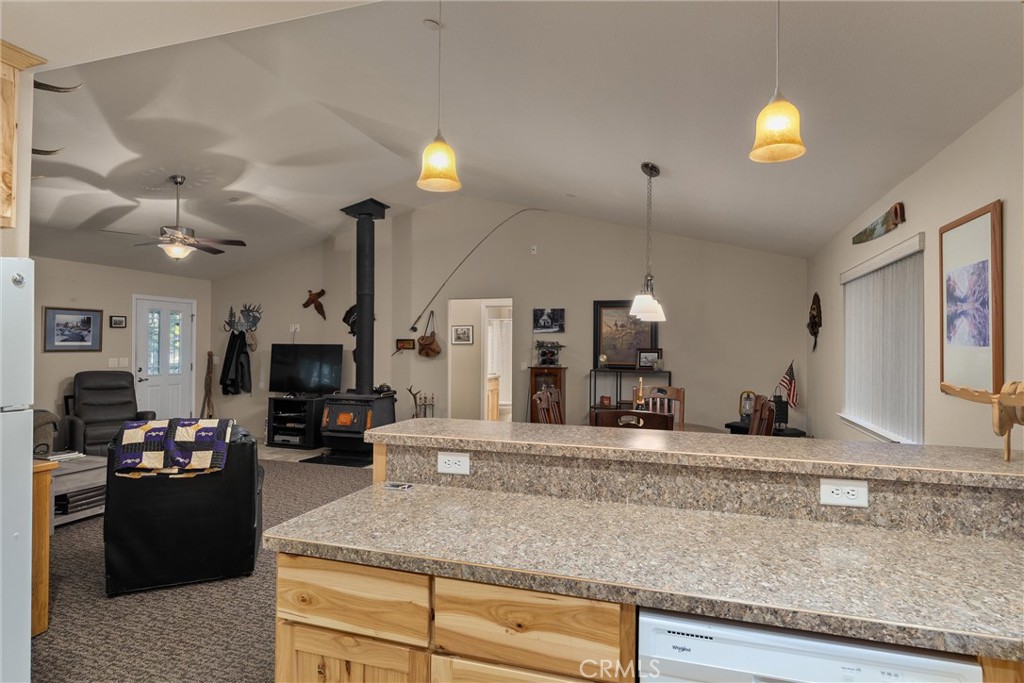 7528 Humboldt Road Butte Meadows, CA 95942 - Photo 16 of 41 a kitchen with kitchen island granite countertop a stove a sink and a granite counter top