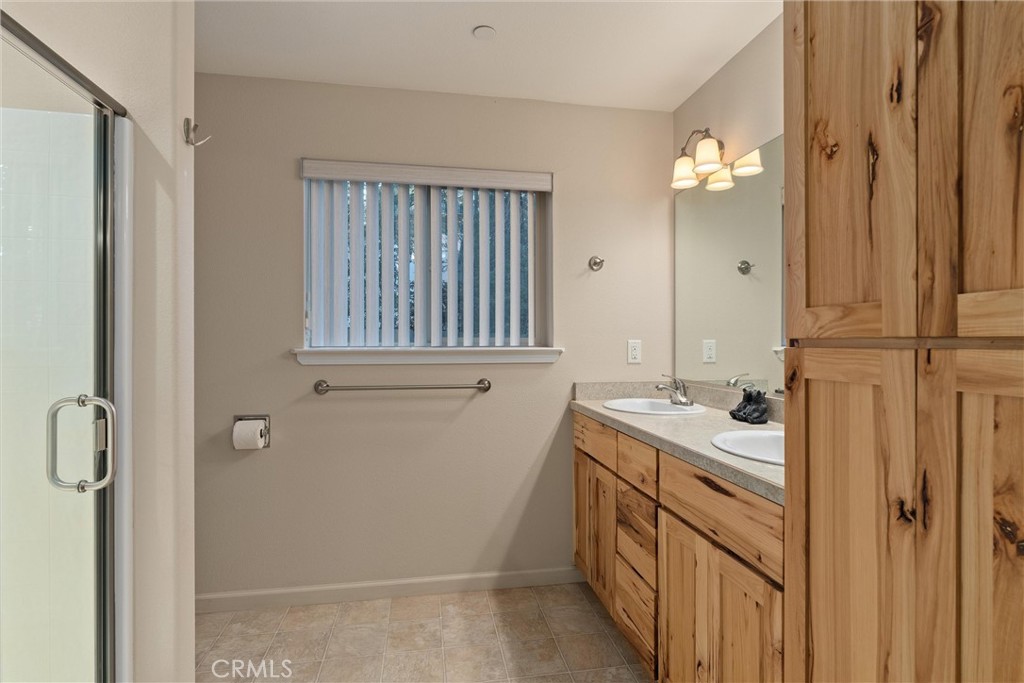 7528 Humboldt Road Butte Meadows, CA 95942 - Photo 22 of 41 a bathroom with a sink a vanity and a mirror