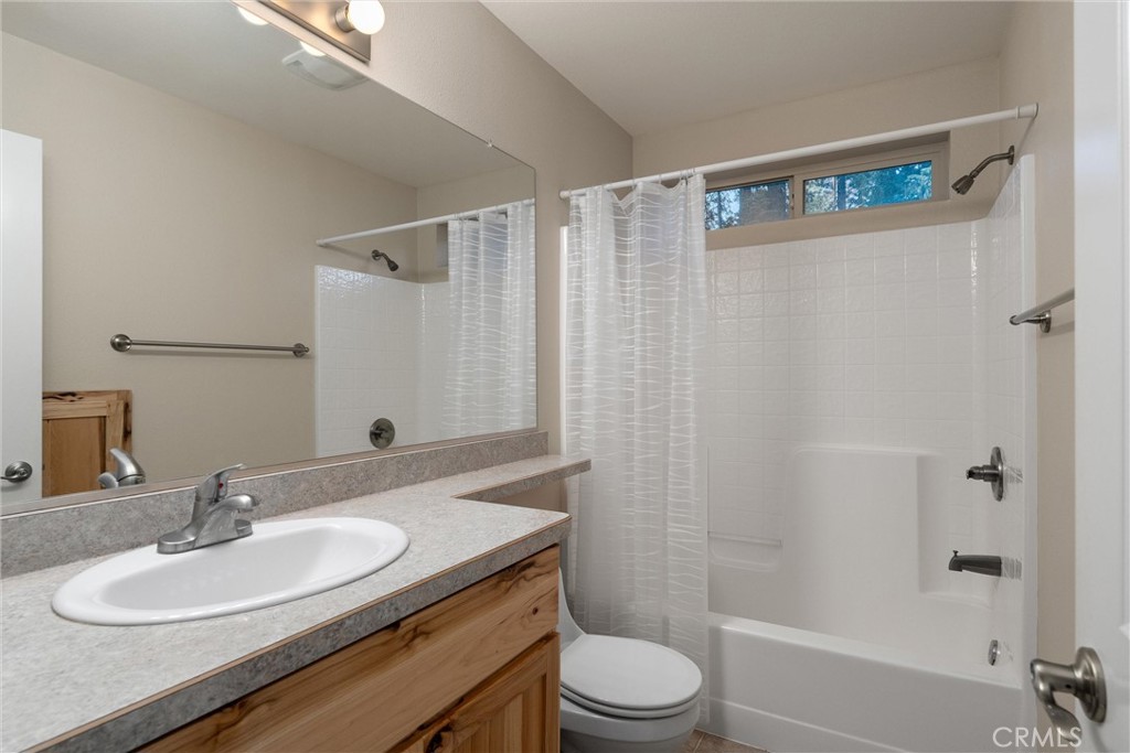 7528 Humboldt Road Butte Meadows, CA 95942 - Photo 24 of 41 a bathroom with a sink a toilet and shower