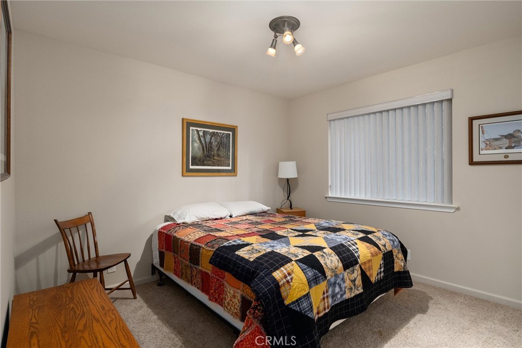 7528 Humboldt Road Butte Meadows, CA 95942 - Photo 25 of 41 a bedroom with a bed chair and window