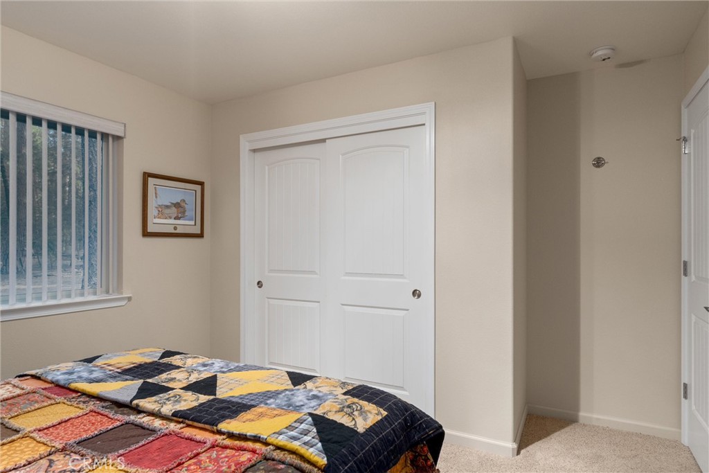 7528 Humboldt Road Butte Meadows, CA 95942 - Photo 26 of 41 a bedroom with a bed and a window