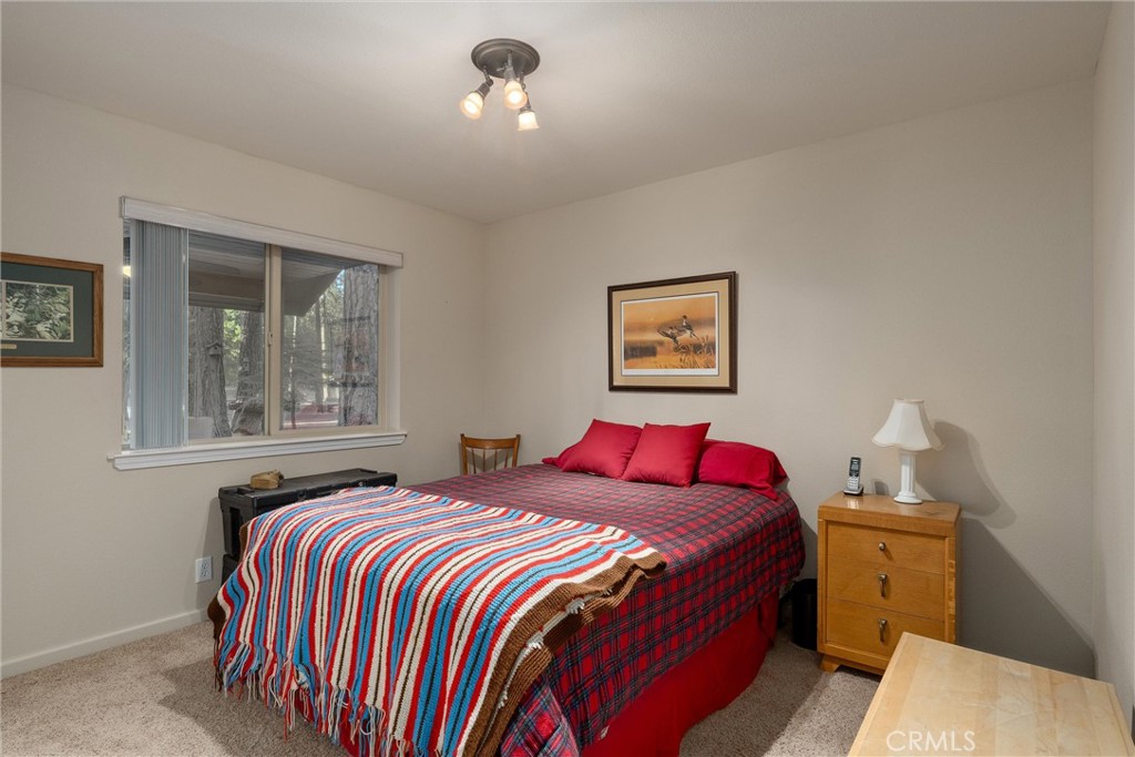 7528 Humboldt Road Butte Meadows, CA 95942 - Photo 27 of 41 a bedroom with bed and window