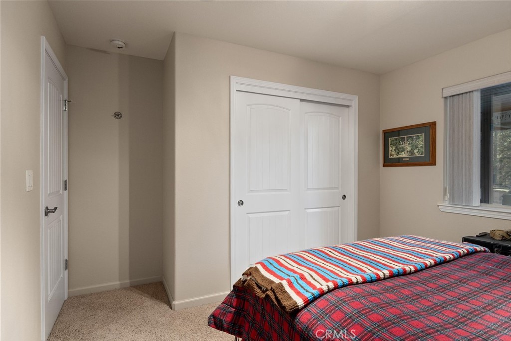 7528 Humboldt Road Butte Meadows, CA 95942 - Photo 28 of 41 a bedroom with a bed and a window