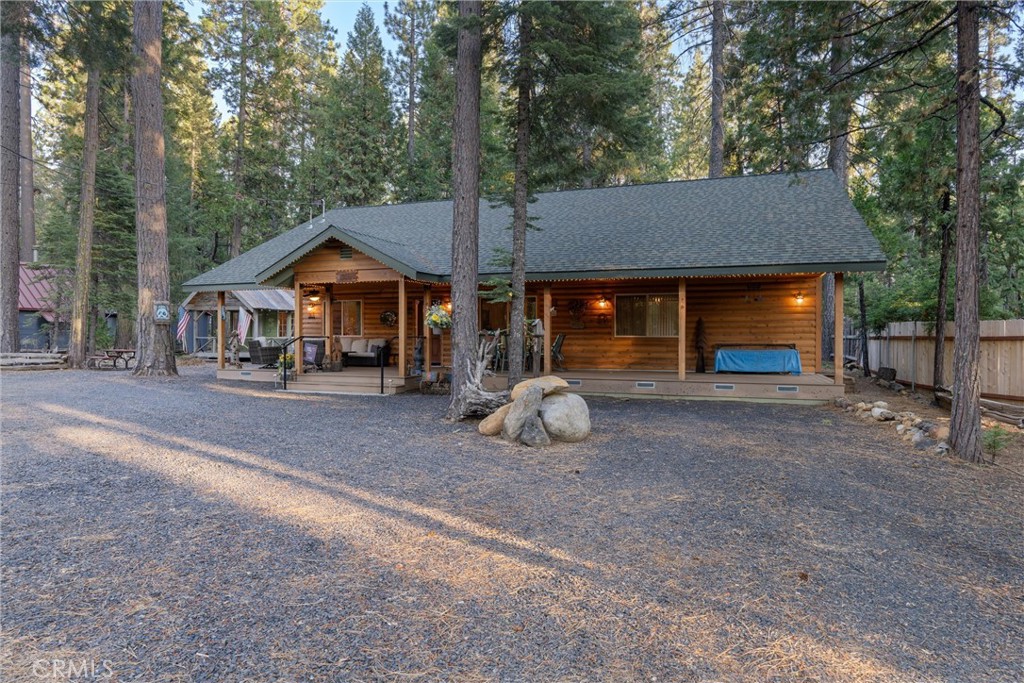 7528 Humboldt Road Butte Meadows, CA 95942 - Photo 38 of 41 a view of a house with a yard and large trees