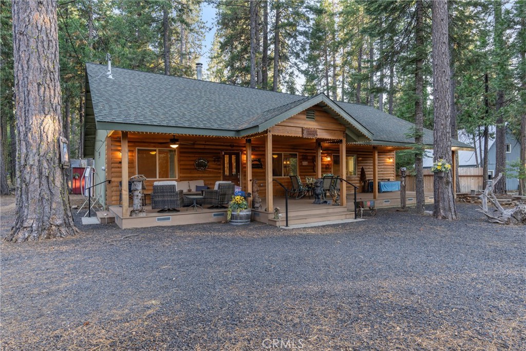 7528 Humboldt Road Butte Meadows, CA 95942 - Photo 39 of 41 a view of a house with a patio and a yard