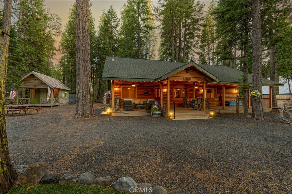 7528 Humboldt Road Butte Meadows, CA 95942 - Photo 40 of 41 a front view of a house with a garden