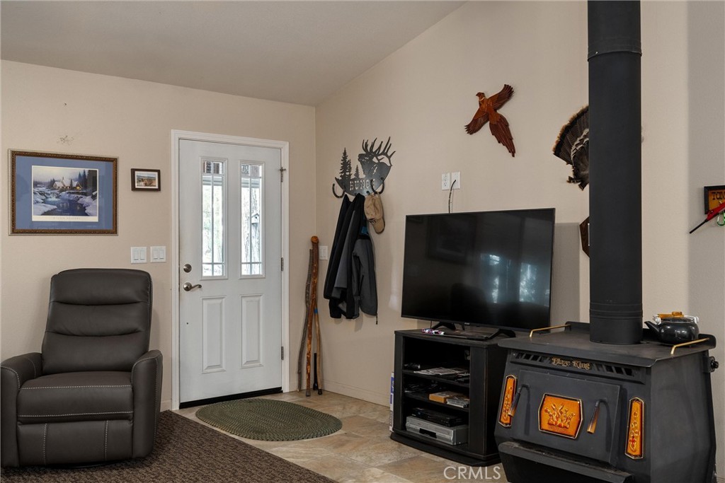 7528 Humboldt Road Butte Meadows, CA 95942 - Photo 6 of 41 a living room with furniture and a flat screen tv