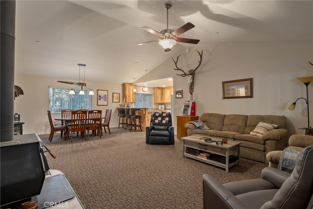 7528 Humboldt Road Butte Meadows, CA 95942 - Photo 7 of 41 a living room with furniture and a chandelier