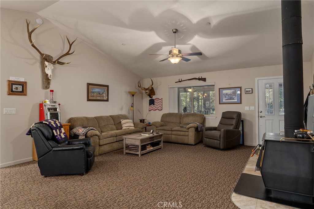 7528 Humboldt Road Butte Meadows, CA 95942 - Photo 8 of 41 a living room with furniture ceiling fan and a rug