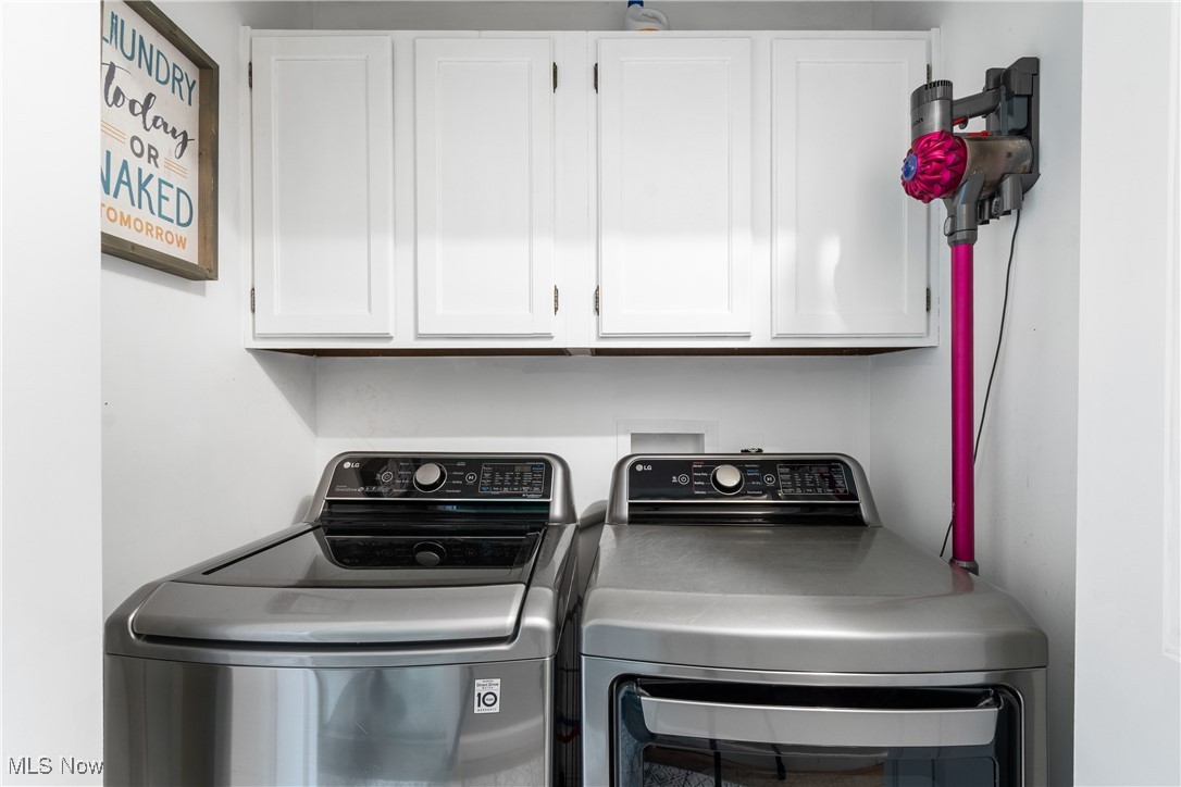 3111 Serfass Road Clinton, OH 44216 - Photo 21 of 34 Laundry area featuring separate washer and dryer and cabinet space