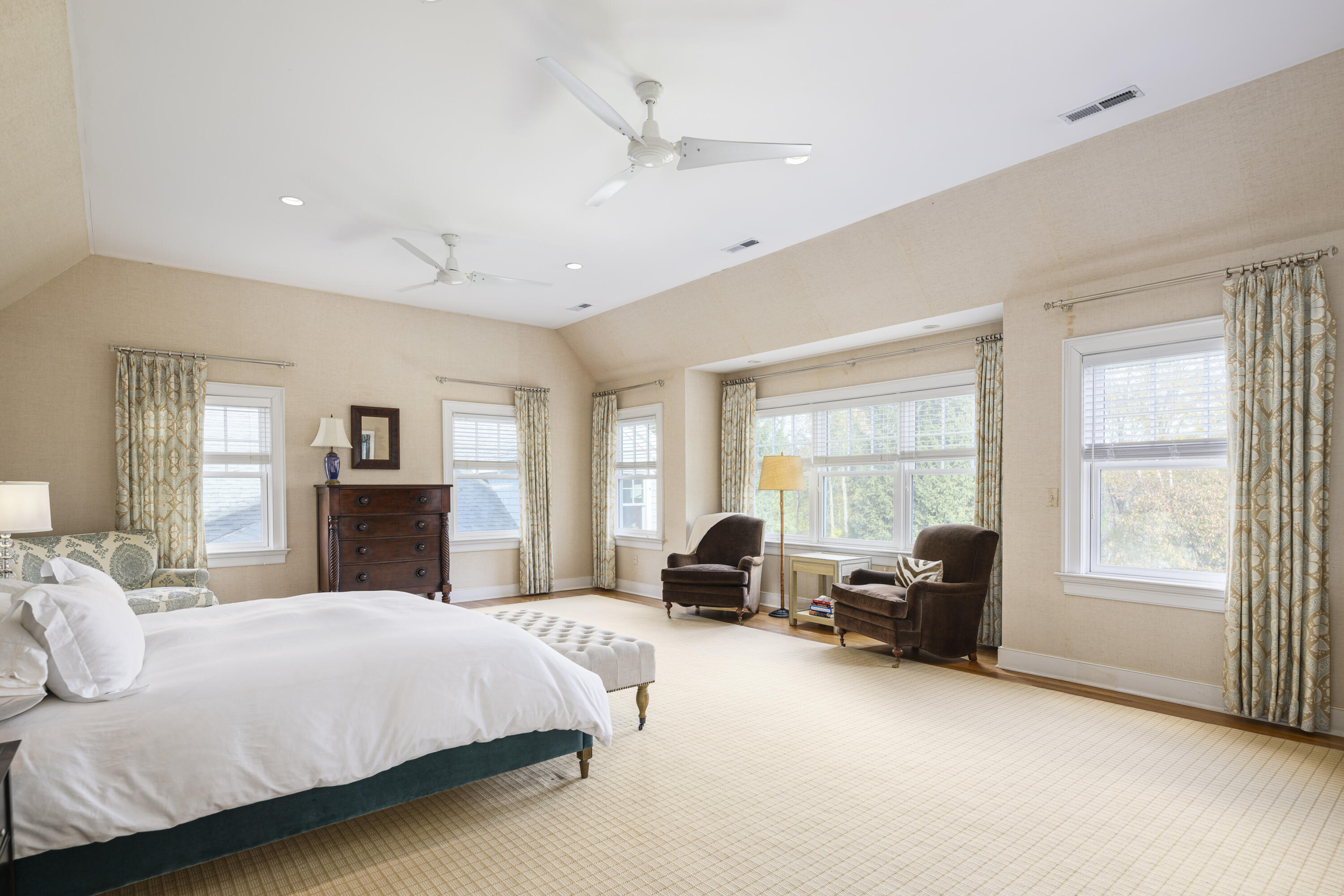 1022 Silvermine Road New Canaan, CT 06840 - Photo 12 of 25 a spacious bedroom with a large bed couch and a window