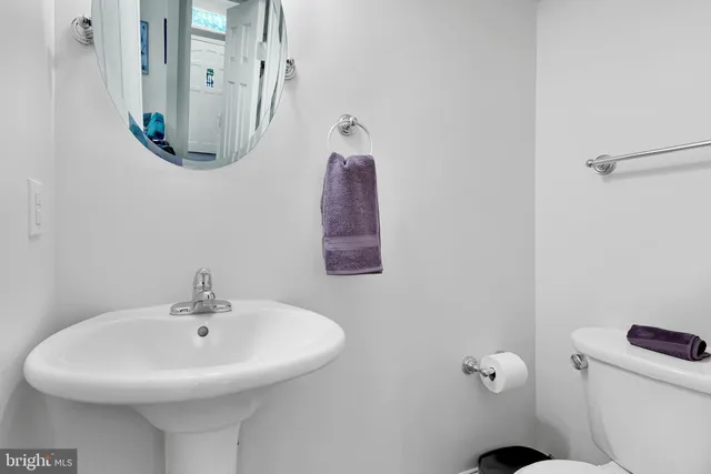 a bathroom with a sink and mirror