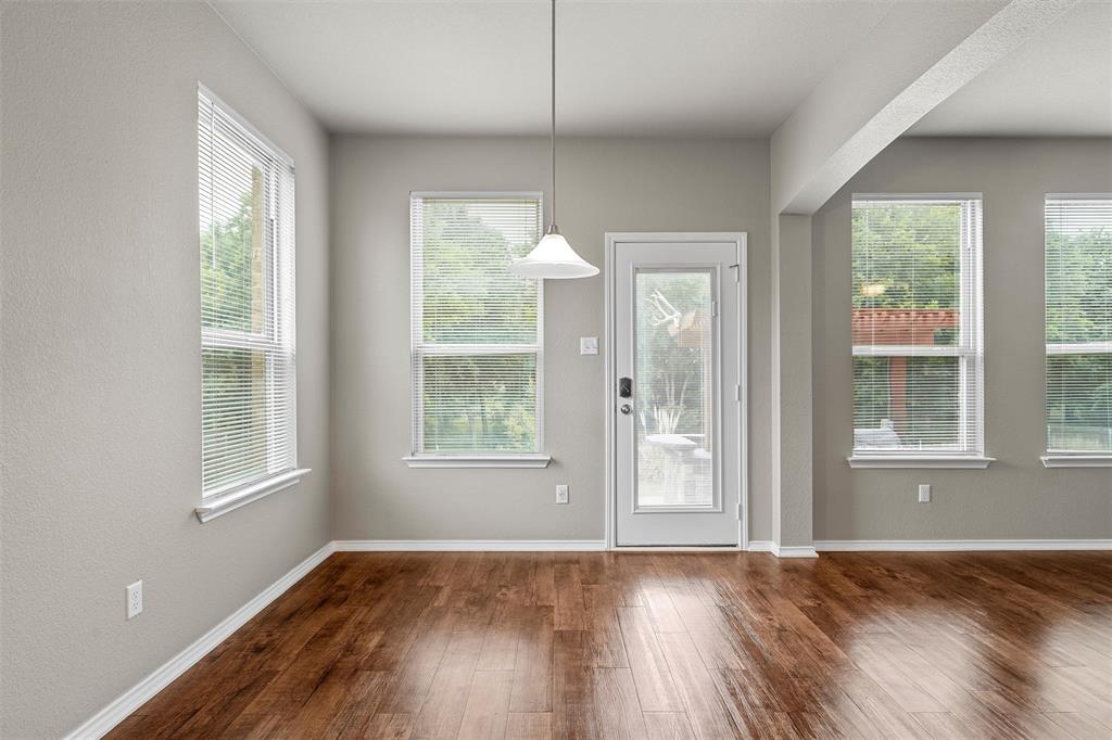 202 Milky Way Road Bruceville, TX 76630 - Photo 15 of 39 an empty room with wooden floor and windows