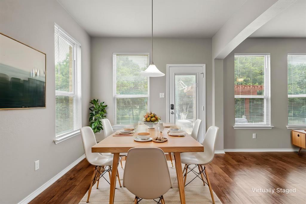 202 Milky Way Road Bruceville, TX 76630 - Photo 16 of 39 a view of a dining room with furniture window and wooden floor