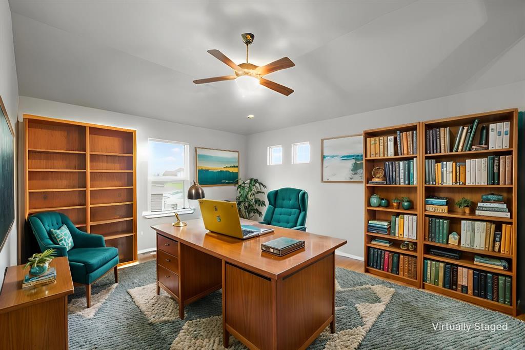 202 Milky Way Road Bruceville, TX 76630 - Photo 23 of 39 a living room with furniture and a book shelf