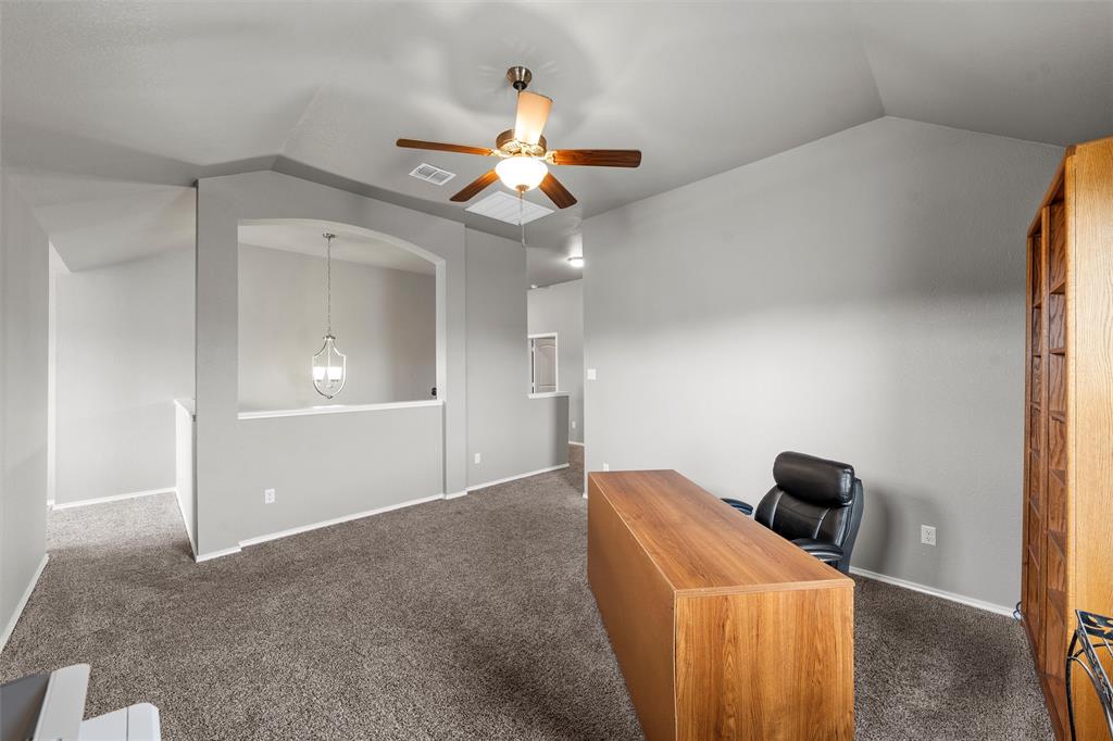202 Milky Way Road Bruceville, TX 76630 - Photo 25 of 39 a view of a livingroom with a chandelier fan and a bathroom