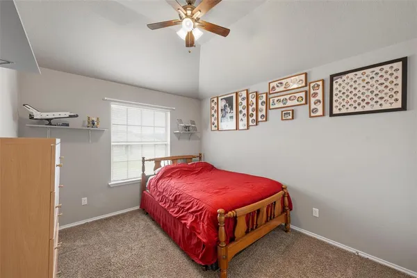 a bed room with a bed and a chandelier
