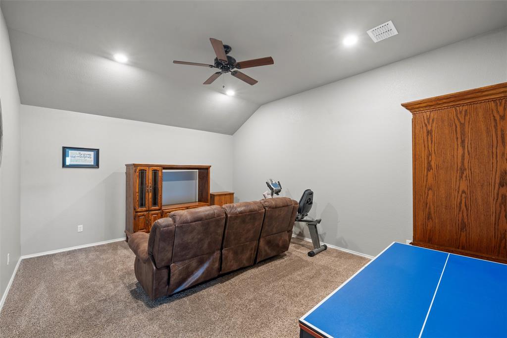 202 Milky Way Road Bruceville, TX 76630 - Photo 32 of 39 a living room with a bed furniture and a window