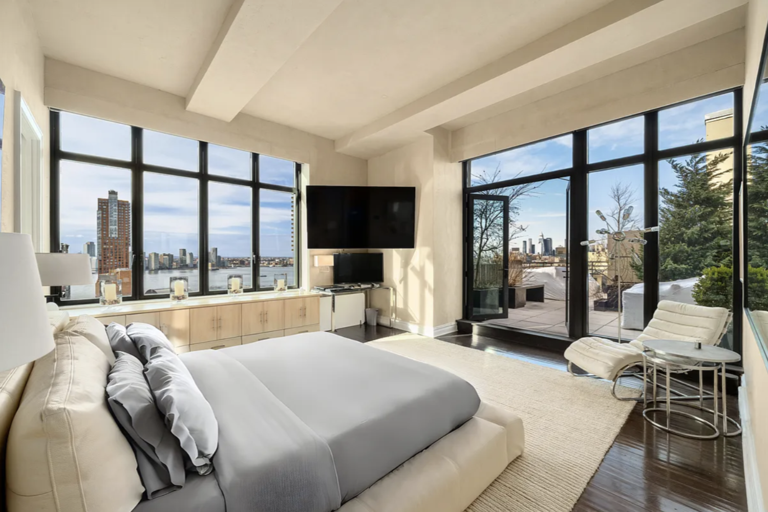 143 Reade Street, Unit PH Manhattan, NY 10013 - Photo 13 of 30 a large bedroom with a large bed and a large window