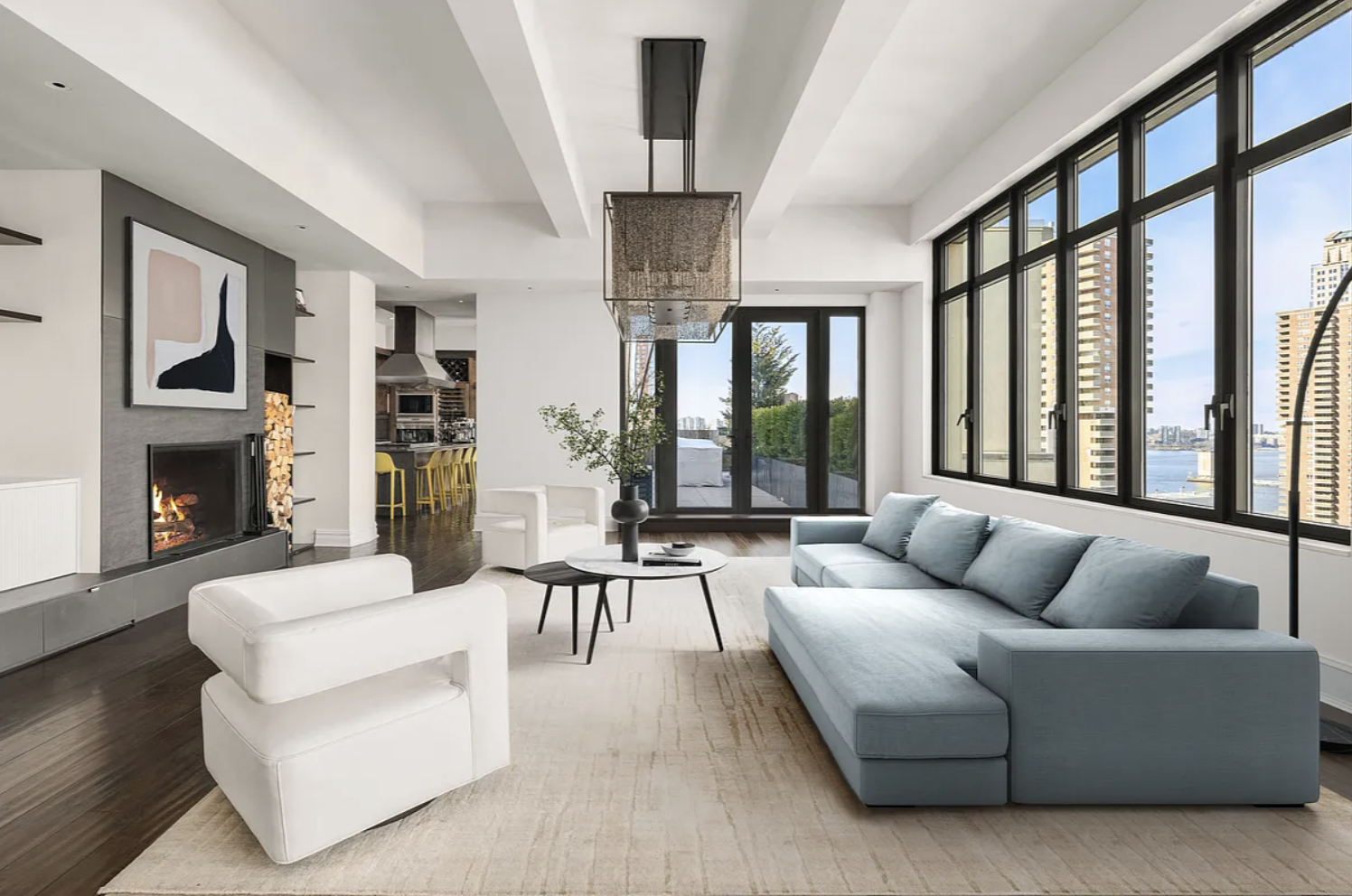 a living room with furniture large window and flat screen tv