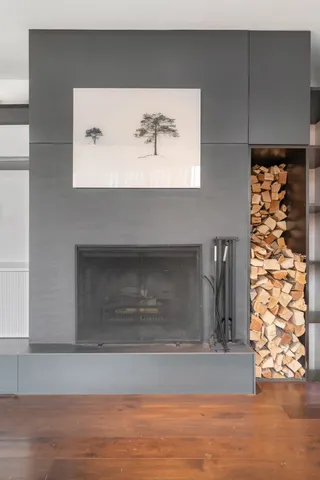 a living room with furniture large window and flat screen tv