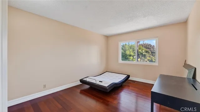 an aerial view of a house with a garden and plants