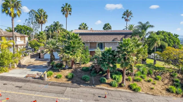 a living room with fireplace furniture and a wooden floor
