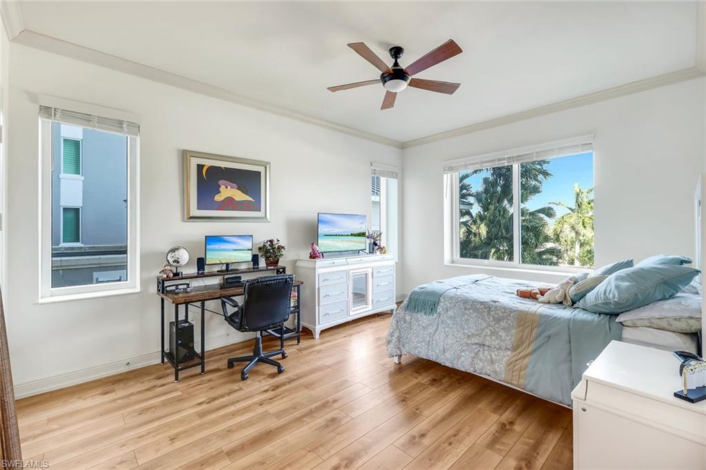 265 Indies Way, Unit T02 Naples, FL 34110 - Photo 21 of 38 a living room with furniture and a window