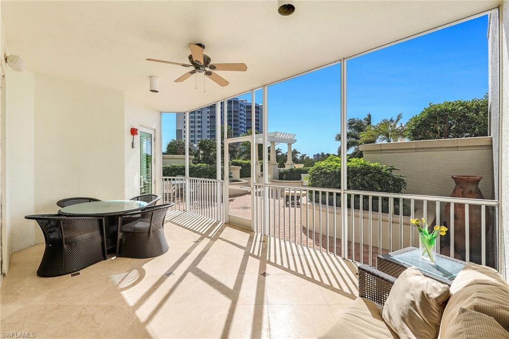 265 Indies Way, Unit T02 Naples, FL 34110 - Photo 25 of 38 a balcony with furniture and a potted plant