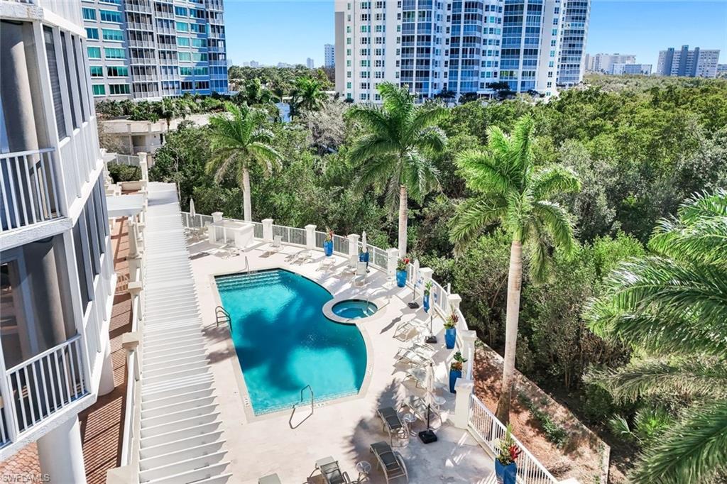 265 Indies Way, Unit T02 Naples, FL 34110 - Photo 31 of 38 a view of a balcony with chairs