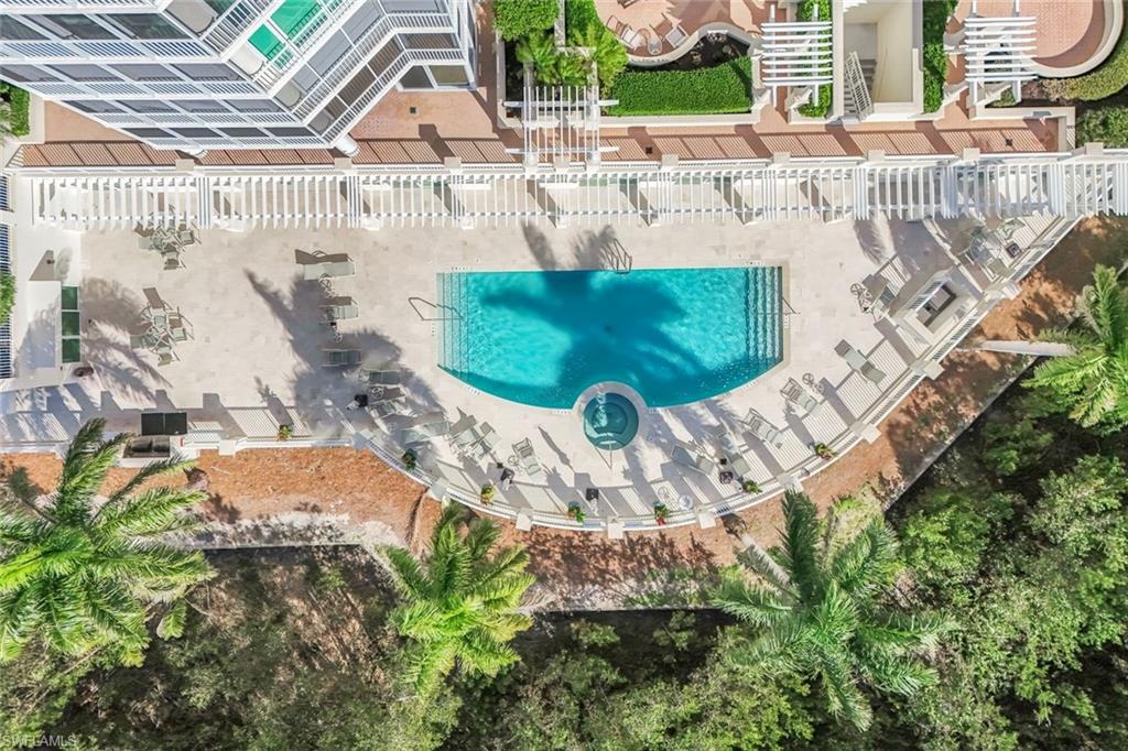 265 Indies Way, Unit T02 Naples, FL 34110 - Photo 35 of 38 a view of swimming pool yard and outdoor space