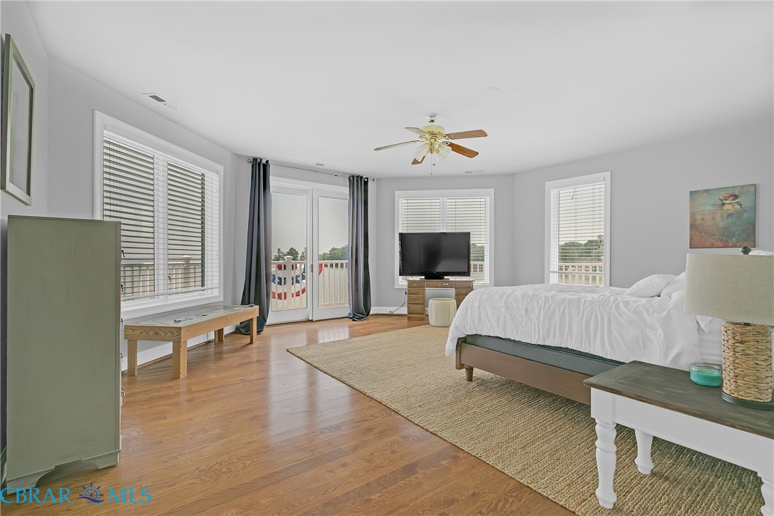 2106 Clarketown Road Heathsville, VA 22473 - Photo 31 of 56 a spacious bedroom with a bed and a flat screen tv