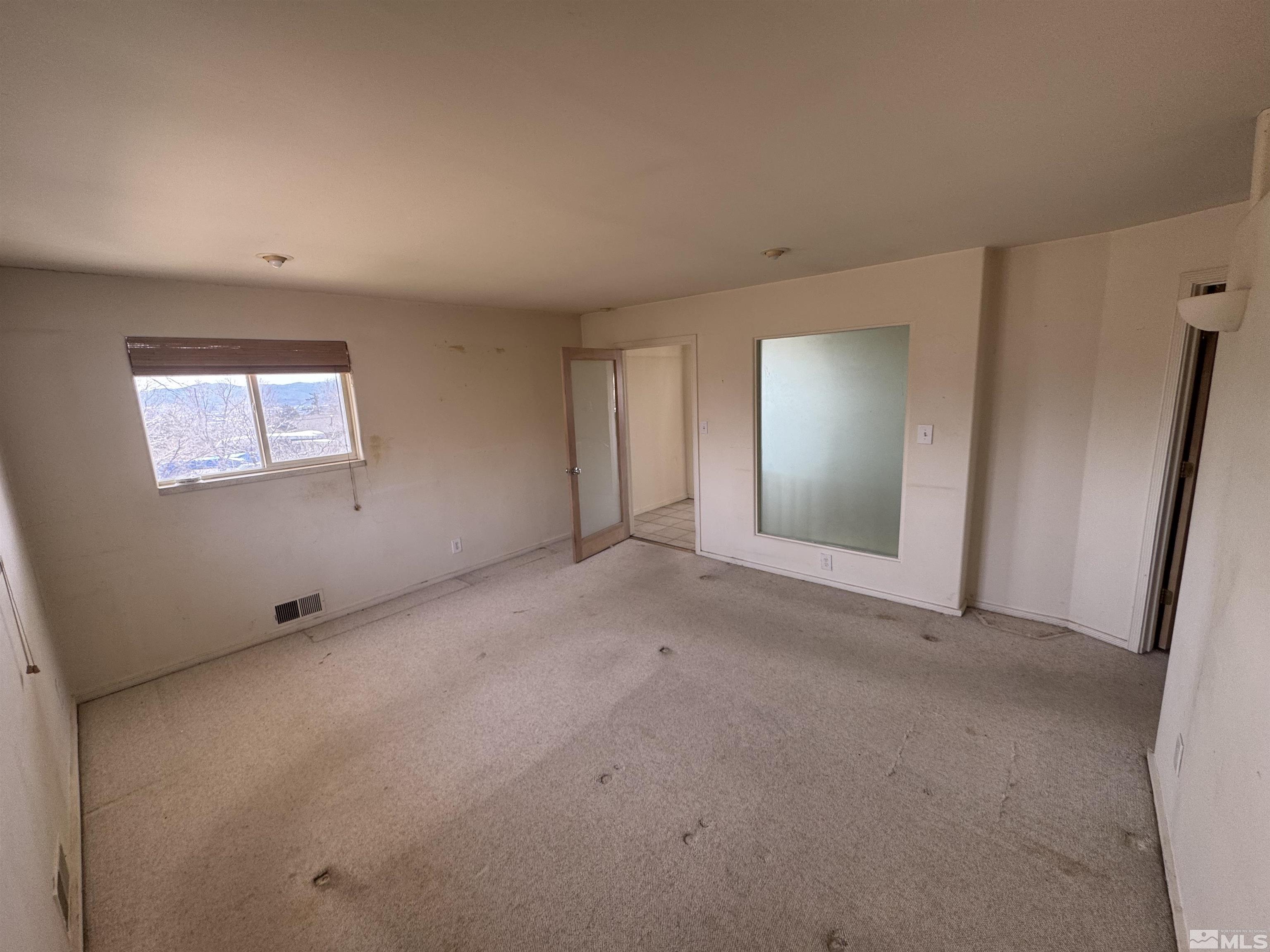 385 Greenstone Drive Reno, NV 89512 - Photo 16 of 34 a view of an empty room with a window