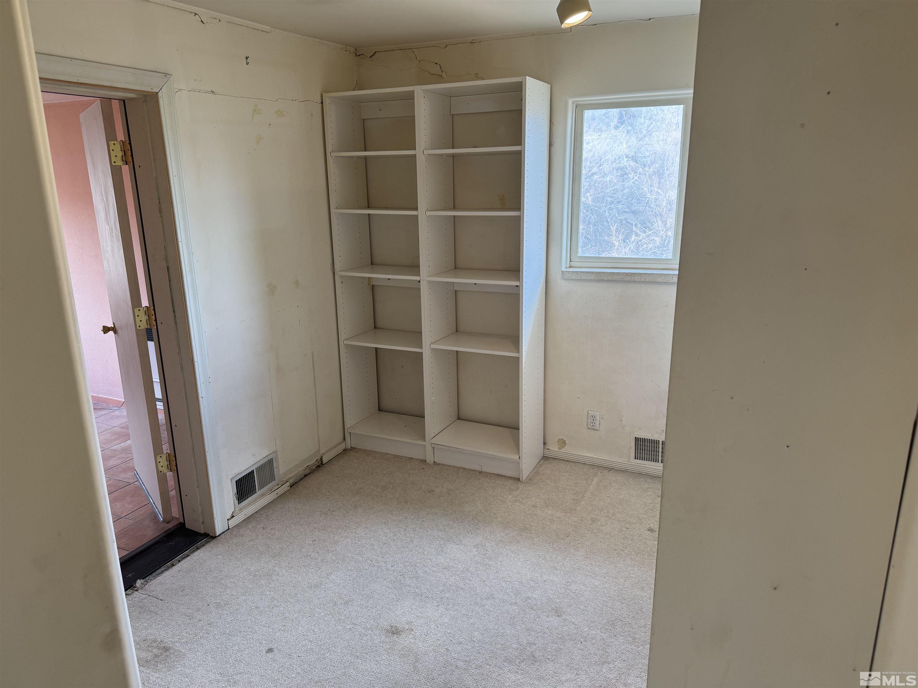 385 Greenstone Drive Reno, NV 89512 - Photo 19 of 34 an empty room with a empty space and window