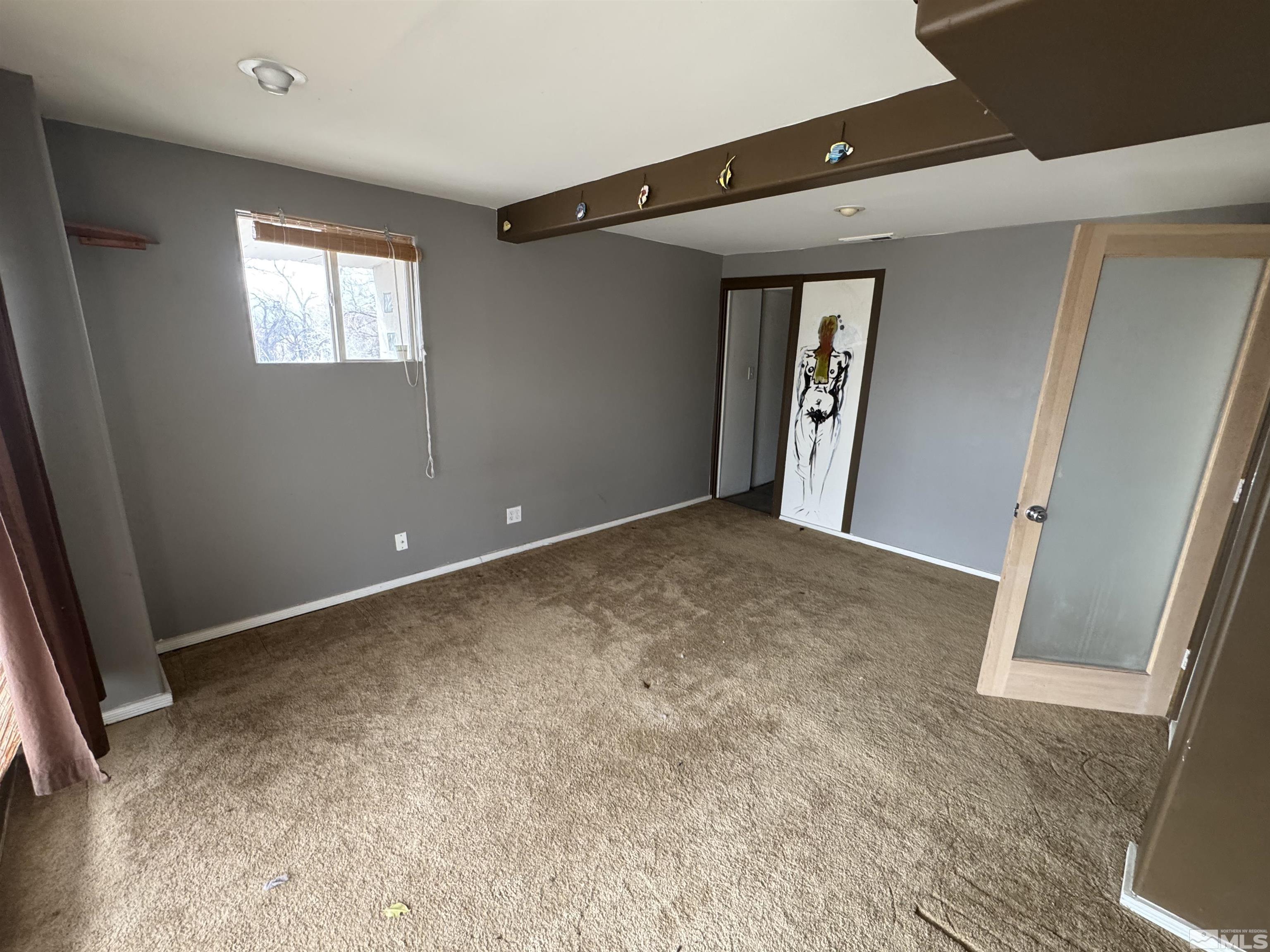 385 Greenstone Drive Reno, NV 89512 - Photo 23 of 34 an empty room with windows