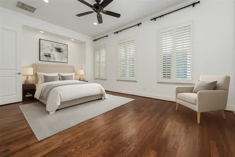 a bedroom with a bed and a couch