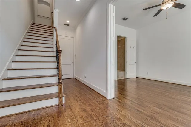 a view of an entryway with wooden floor