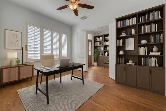 a workspace with furniture window and wooden floor