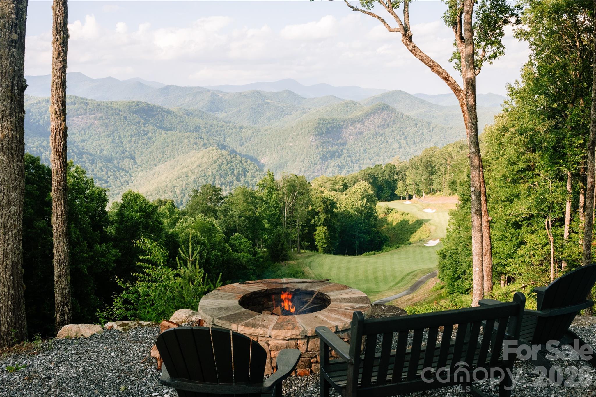 762 Scarlet Oak Road Tuckasegee, NC 28783 - Photo 18 of 26 a view of a couches and a table in the balcony