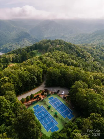 an aerial view of residential house with outdoor space and trees