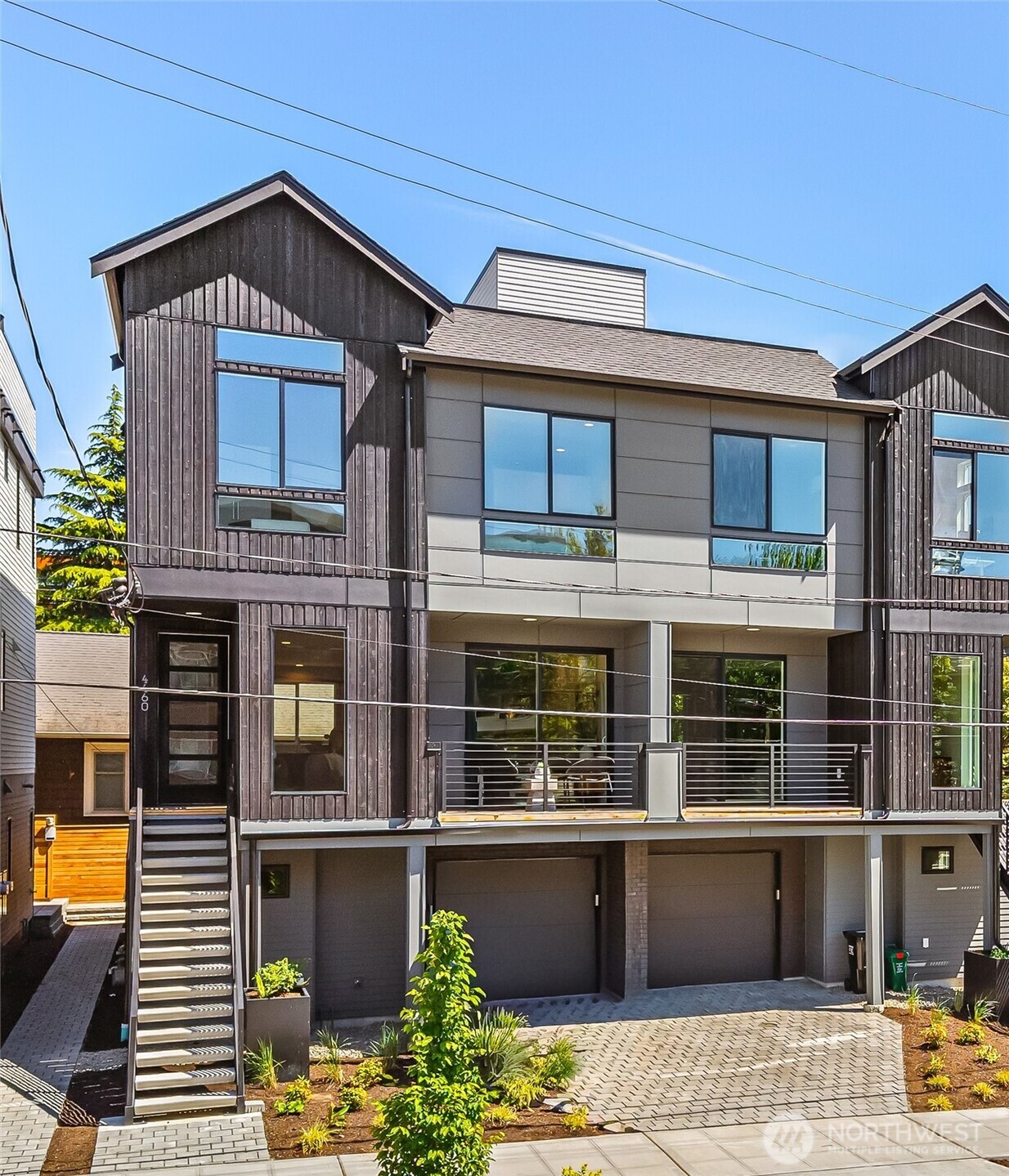 4460 Midvale Avenue North Seattle, WA 98103 - Photo 1 of 40 a front view of a house with a balcony