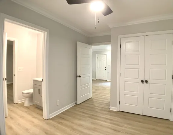 a bathroom view of a toilet and a shower