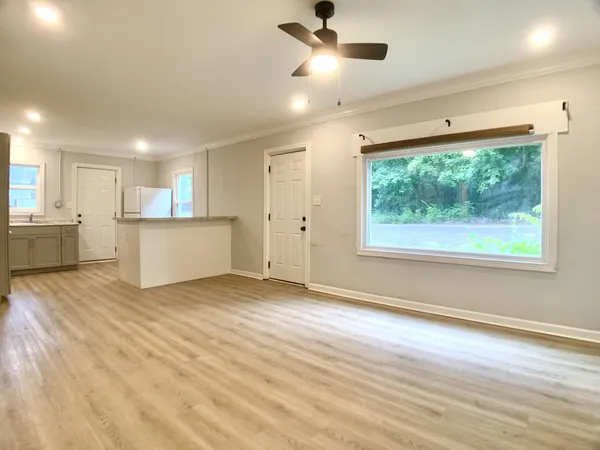 a view of a kitchen with a sink and a window